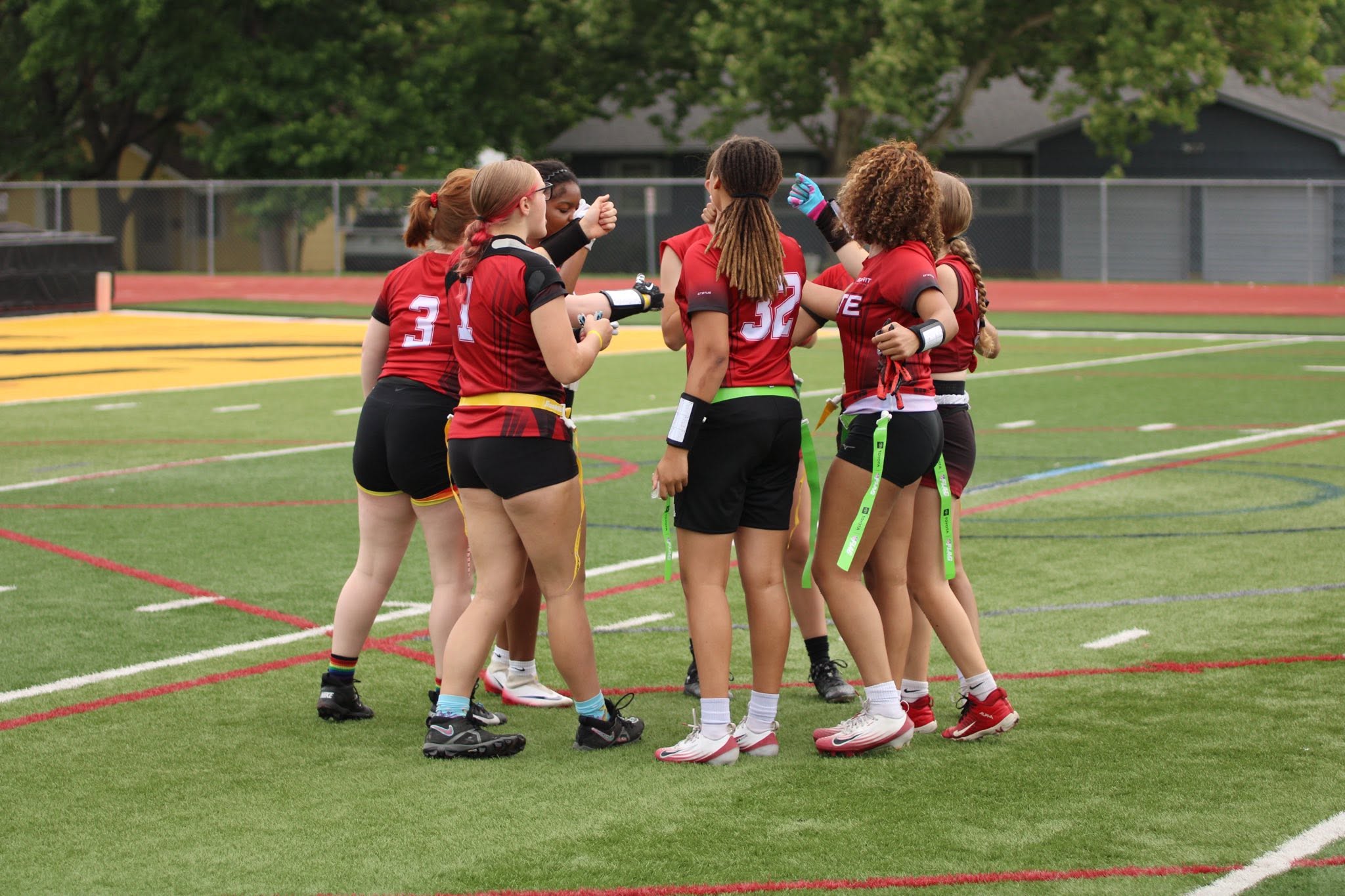 Jr. Stockmen athletes gathering together on the football field